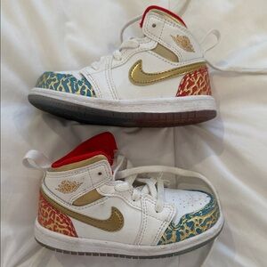 Nike Kids Jordan 1 White and Gold Sneakers with Red Accents